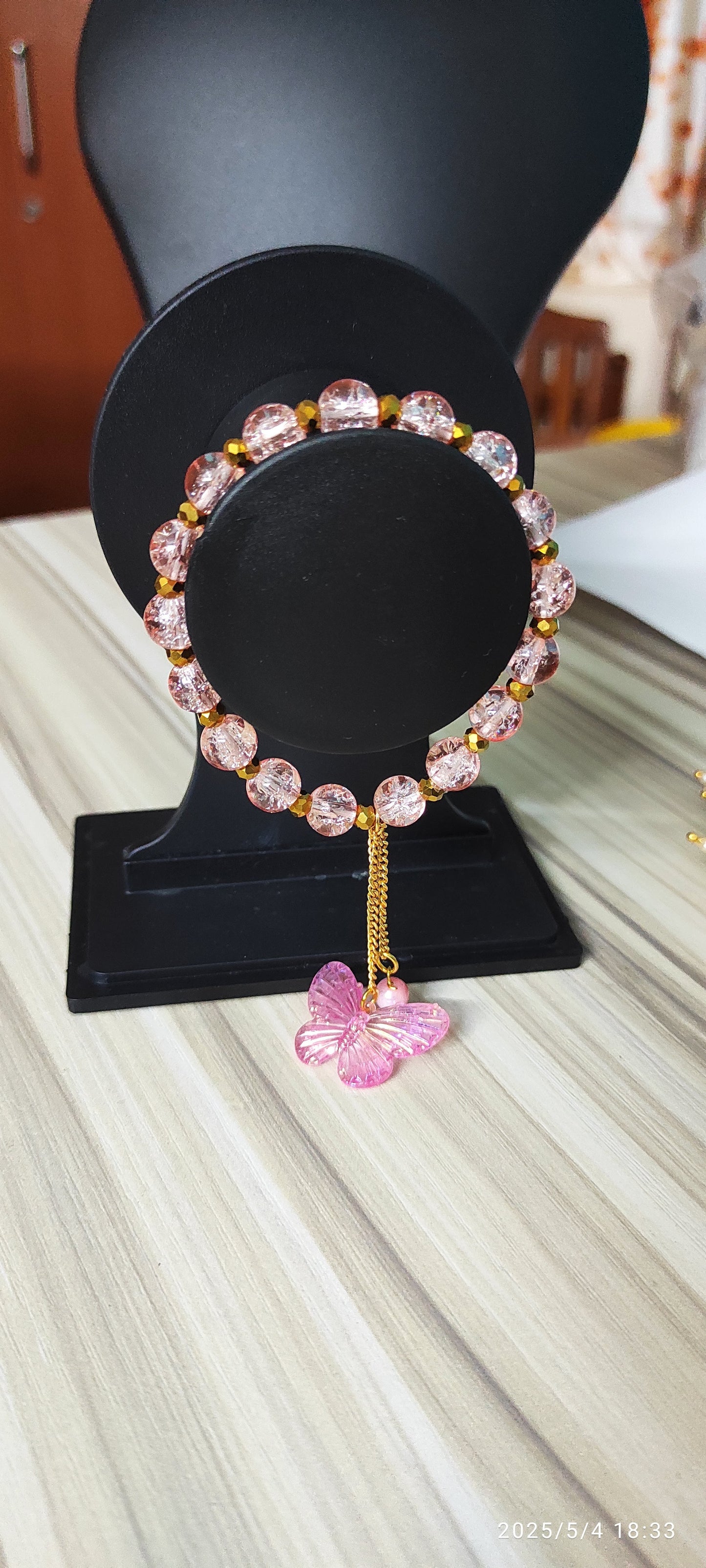 Icy Pink glass beads with butterfly charm designer handmade bracelet.