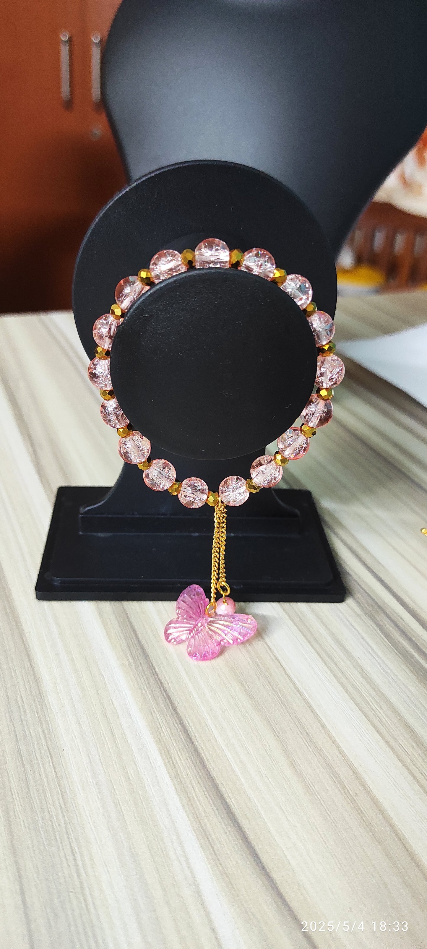 Icy Pink glass beads with butterfly charm designer handmade bracelet.